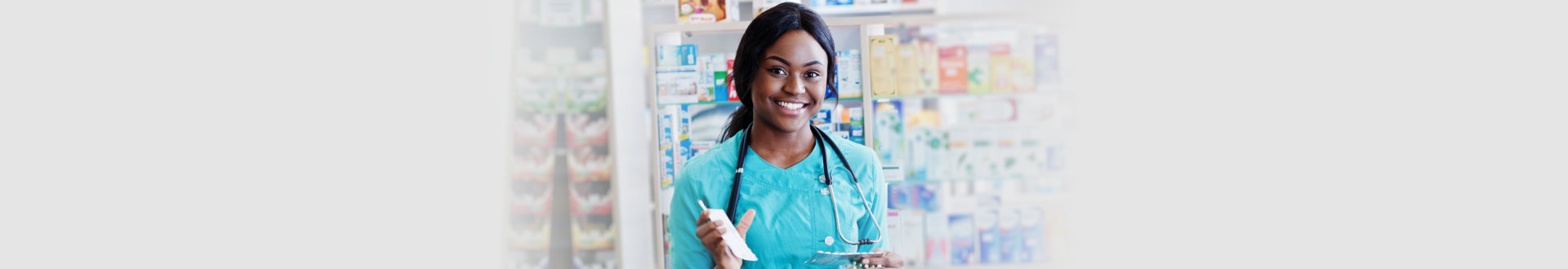 African american pharmacist working in pharmacy